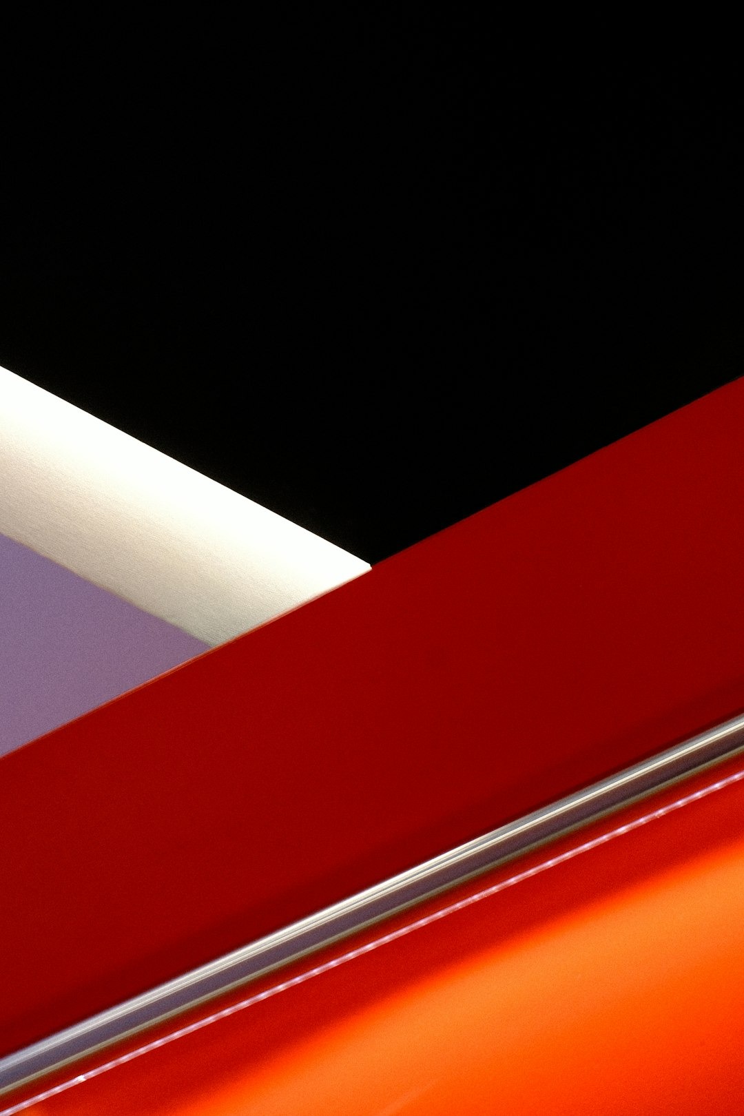 Geometric shapes including triangles and trapezoids in red and orange.